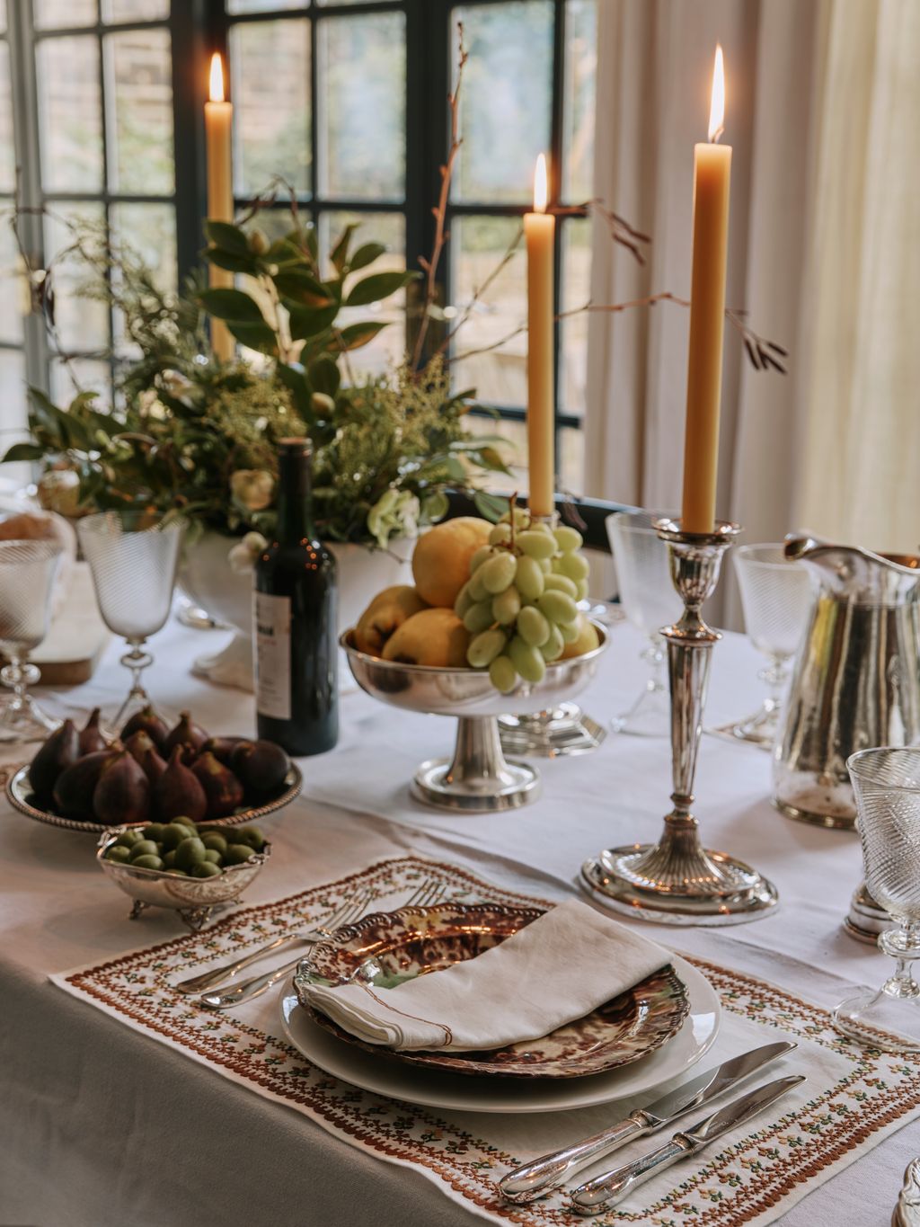 Image may contain Candle Candlestick Plate Blade Knife Weapon Furniture Table and Tabletop