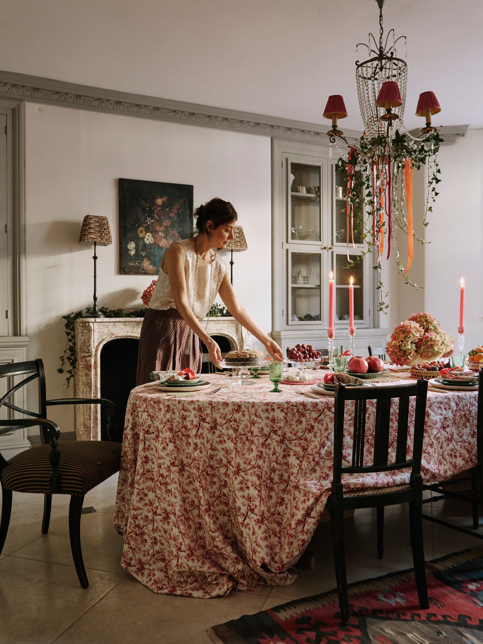 Image may contain Tablecloth Adult Person Lamp Chair Furniture Table Architecture Building and Dining Room