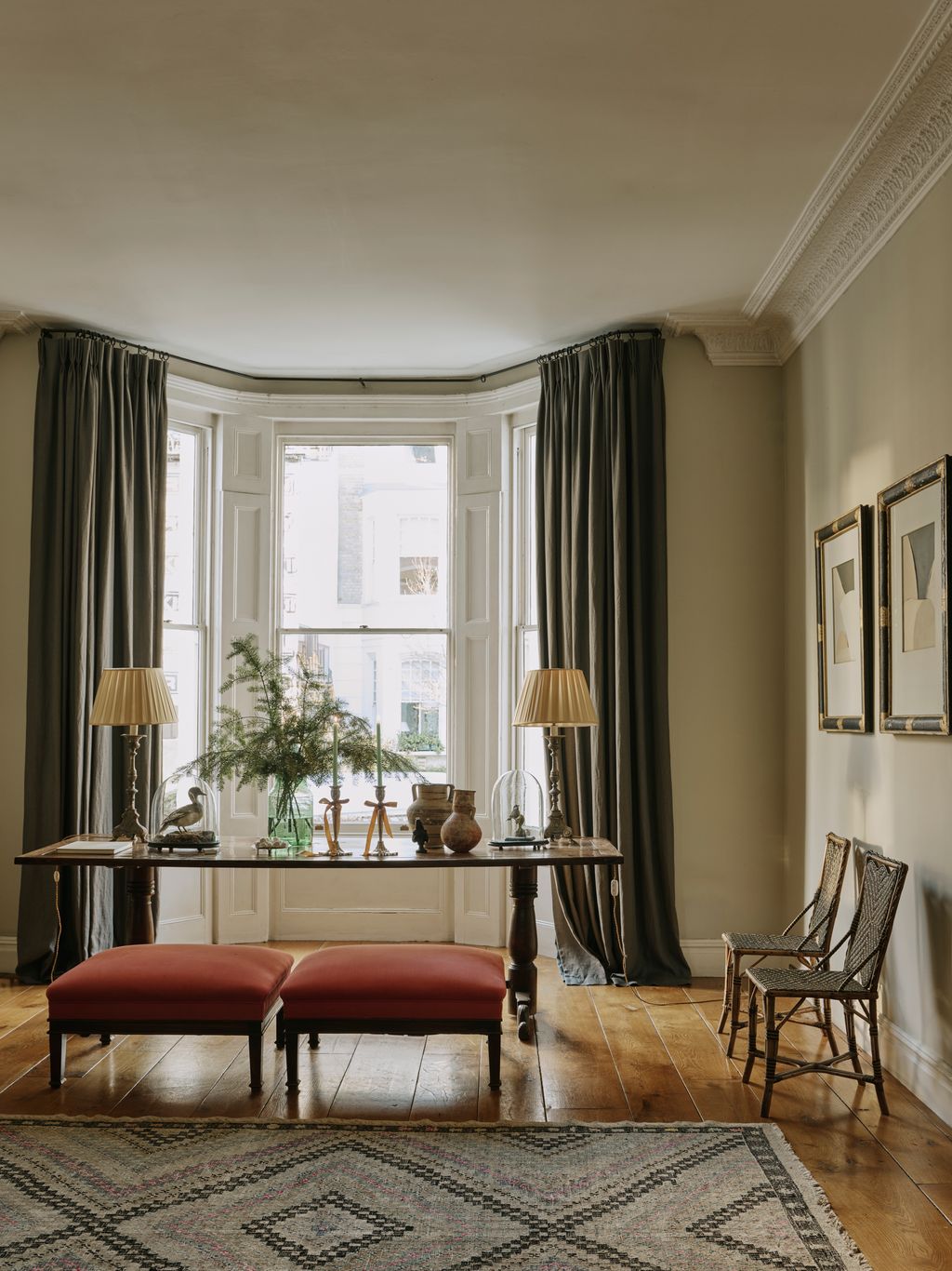 Image may contain Window Lamp Chair Furniture Home Decor Rug Bay Window Plant Animal Bird Art and Painting